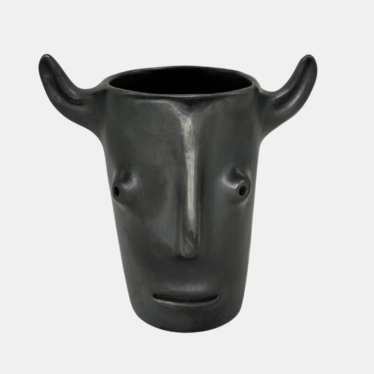 Face with horns vase